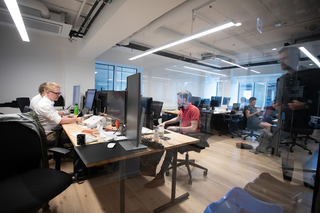 Modern startup office with diverse team working on technology projects